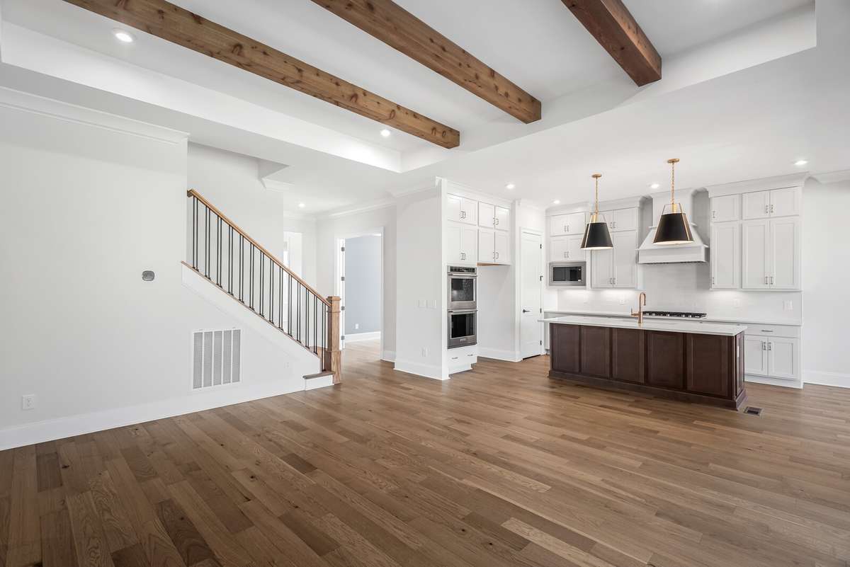Cedar beams within the tray ceiling offer warmth to this light filled Family room.