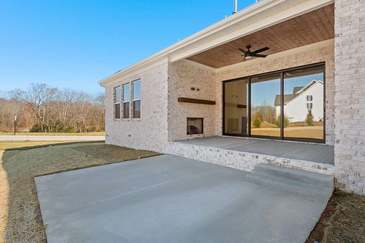 In addition to the rear covered outdoor living area, an additional concrete patio has been added
