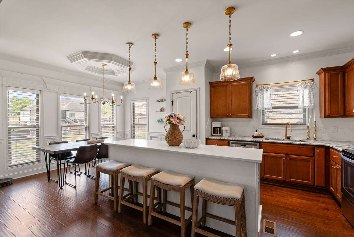 BEAUTIFULLY UPDATED KITCHEN WITH NEW ISLAND AND LIGHT FIXTURES