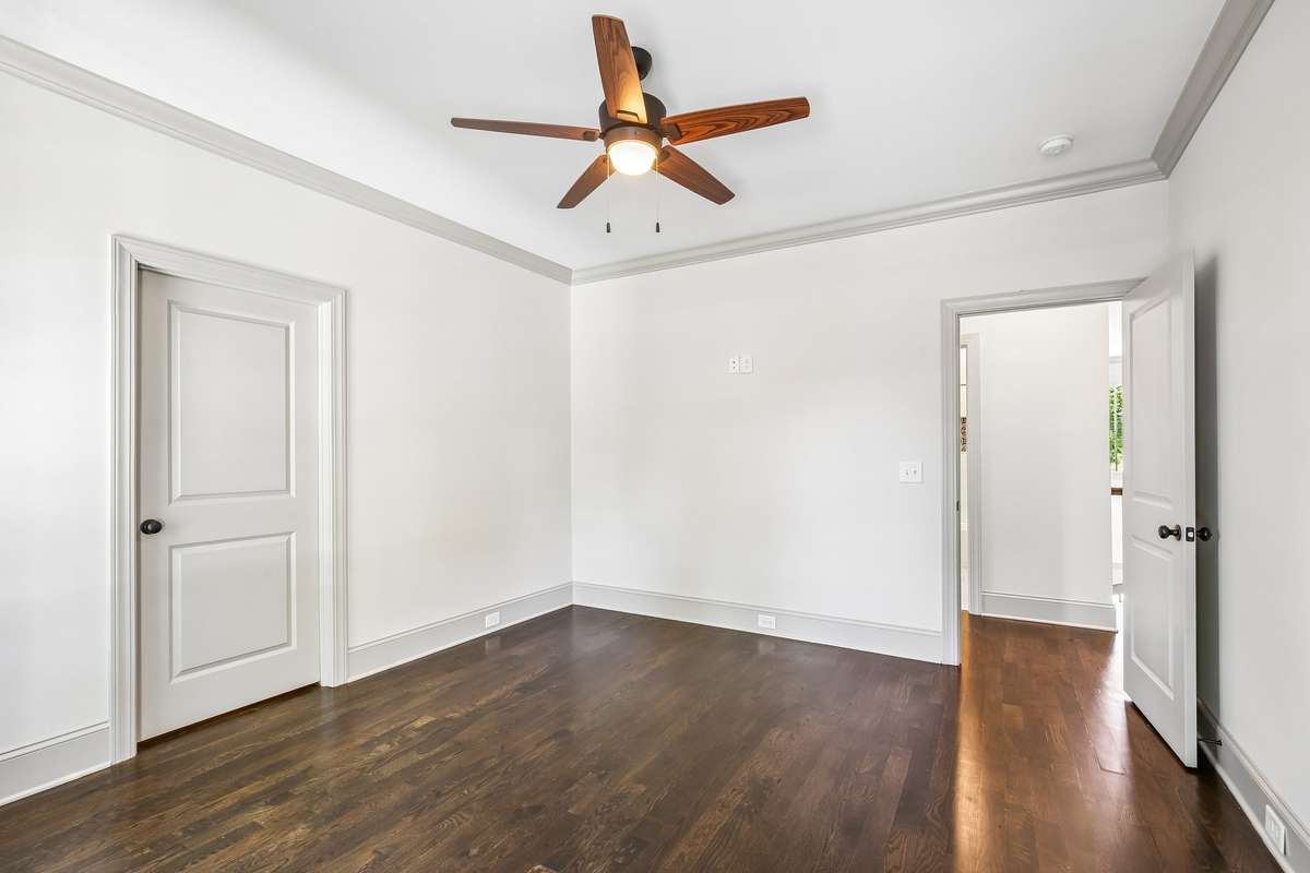 Bedroom with hardwood floors and clean finishes