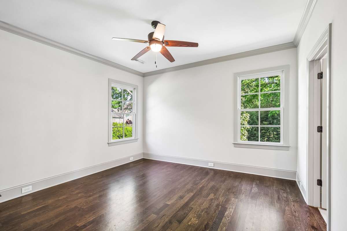 Bedroom with hardwood floors and natural light