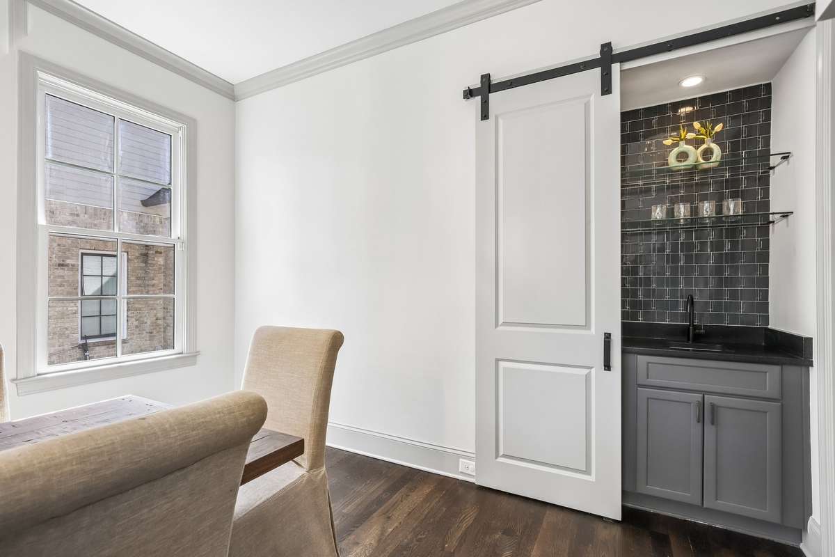 Butler’s pantry with sliding barn door and built-in storage