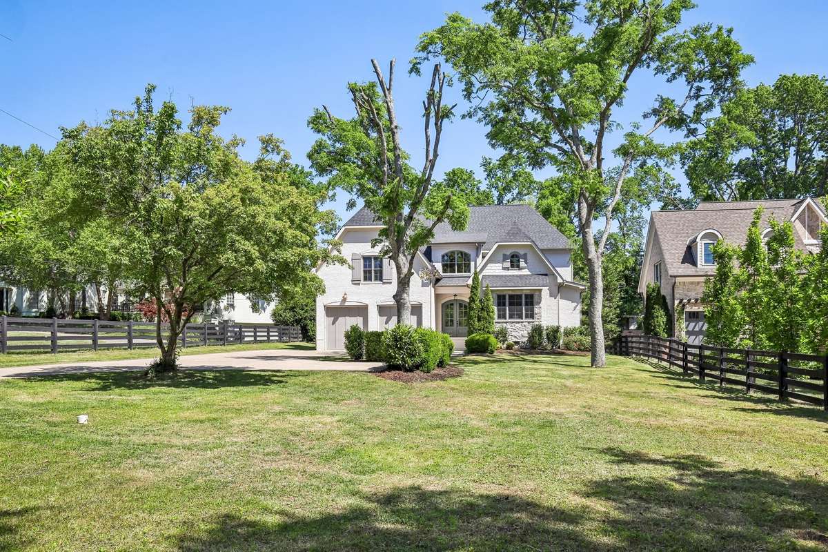 Front exterior with extended driveway