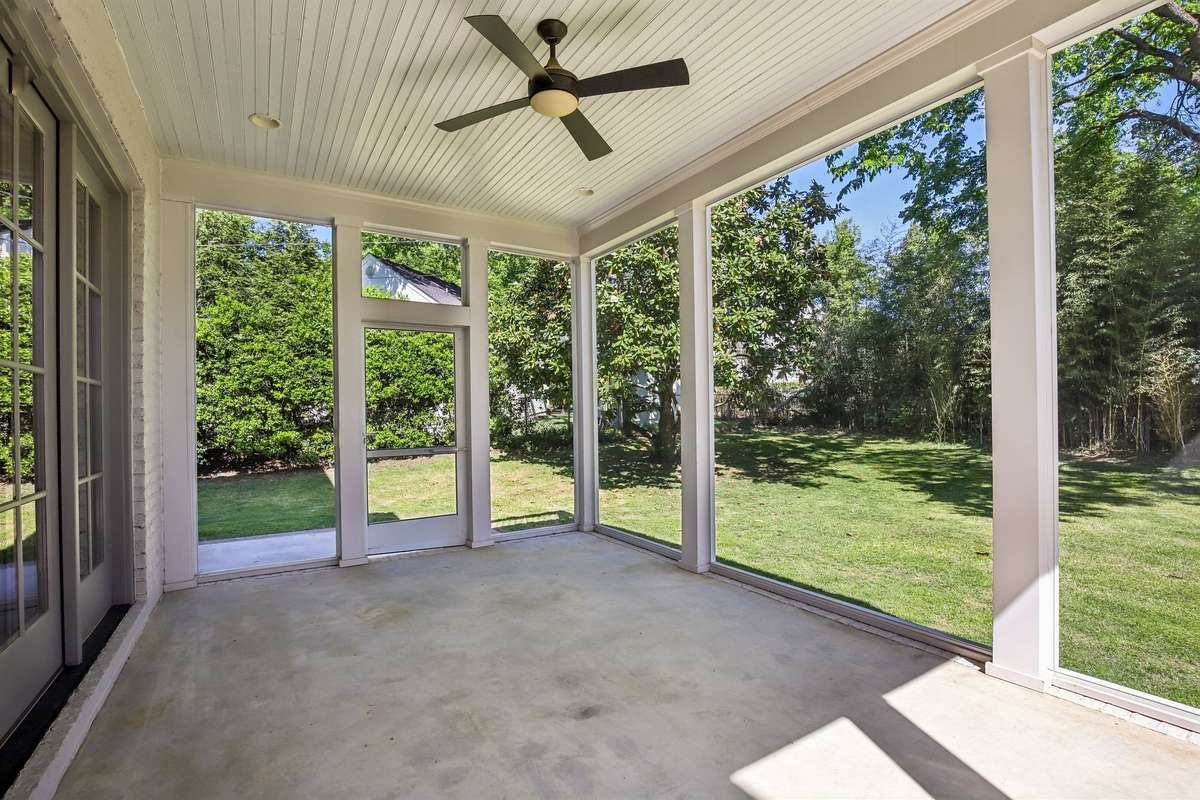 Screened-in patio overlooking the backyard