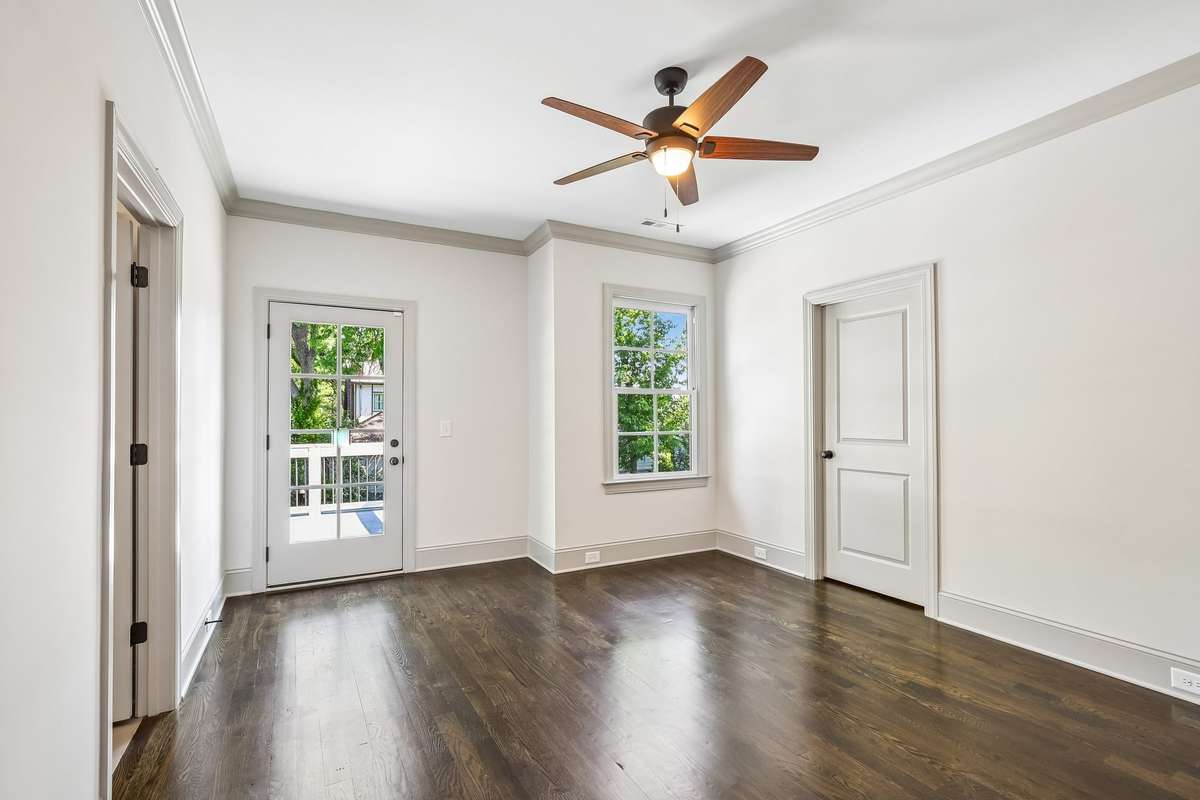 Bedroom with hardwood floors and natural light
