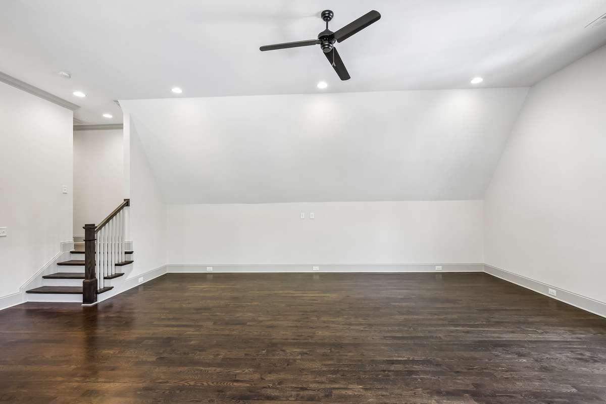 Spacious bonus room with hardwood floors