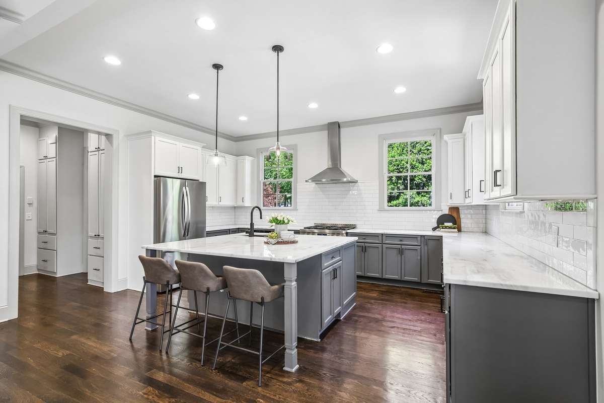 Open kitchen with island seating and ample cabinet storage