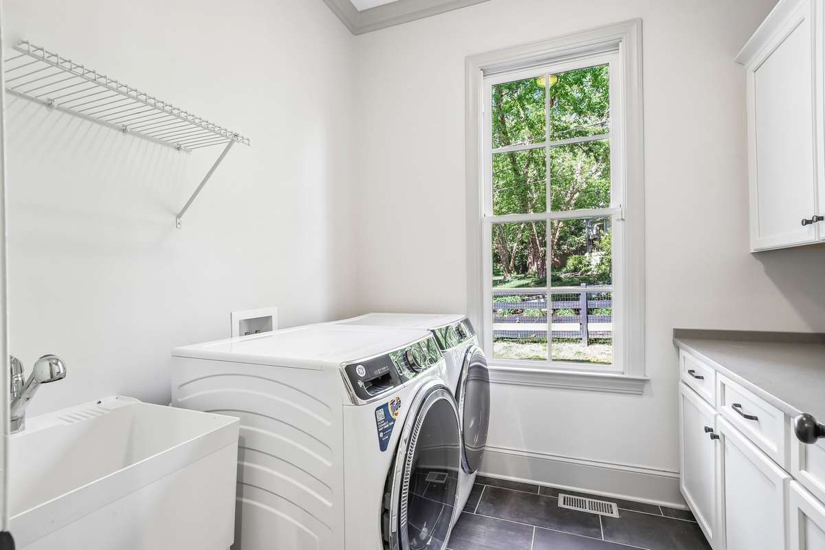 Laundry room with storage and natural light