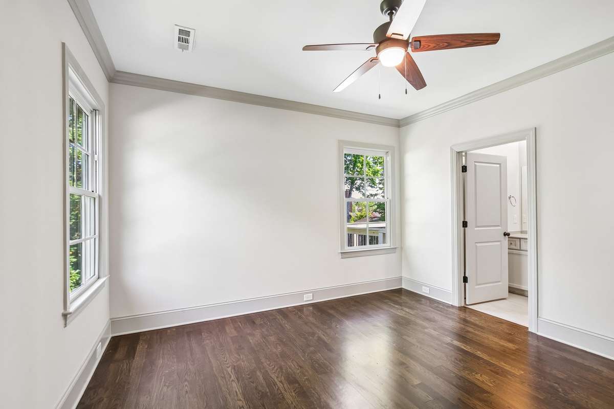 Bedroom with hardwood floors and ceiling fan