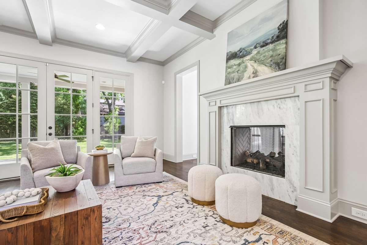 Fireplace with detailed surround and custom millwork