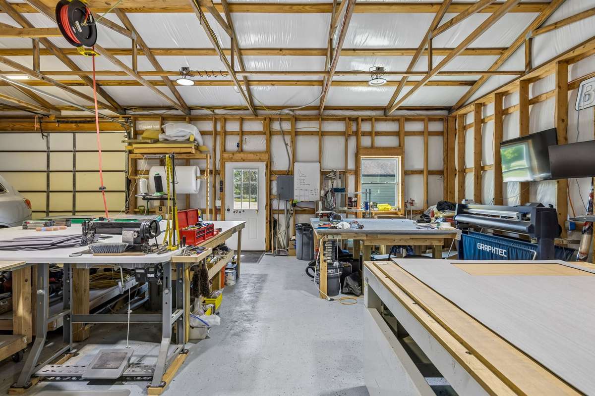 Additional view of the shop interior showcasing workstations, storage areas, and versatile functionality.