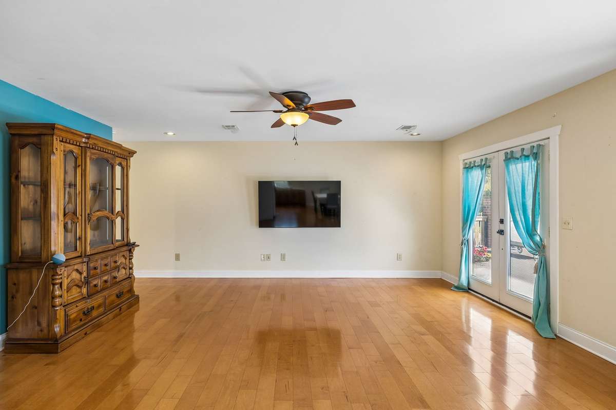 Guest house. Spacious living room featuring French doors leading to outdoor space, enhancing indoor-outdoor flow.