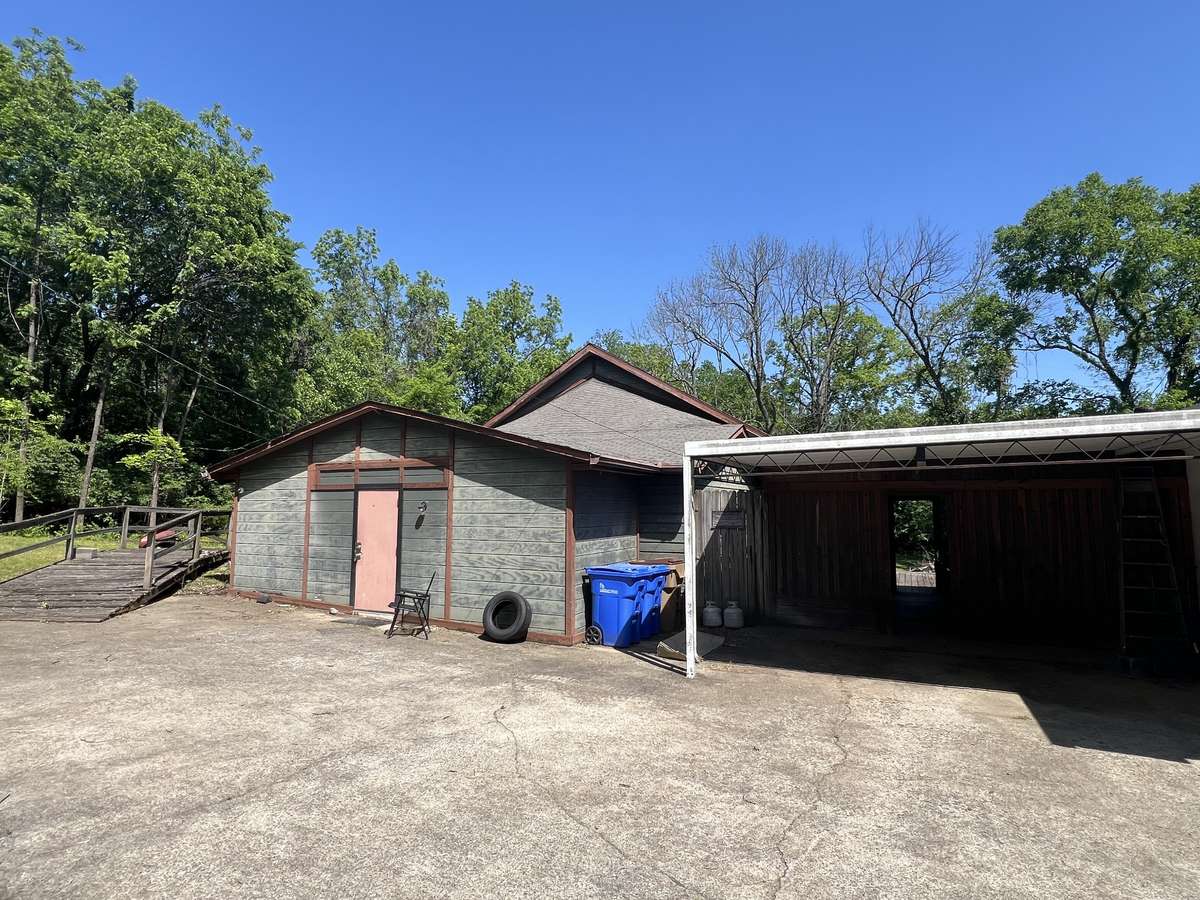 back main studio, carport & screened in porch