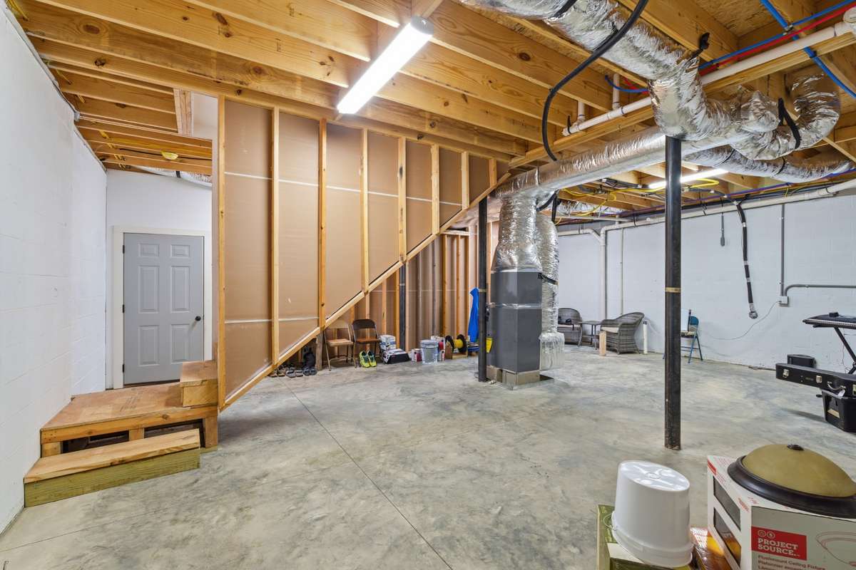 Living space side of basement is 24x28. Plumbing pipes for bathroom is already in place. You could easily add a bedroom, bath and den.