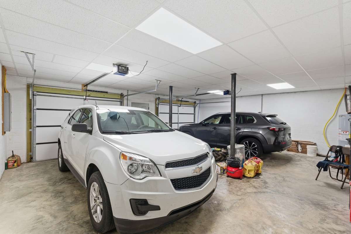 Garage side of basement. Drop ceiling already installed to meet fire codes.