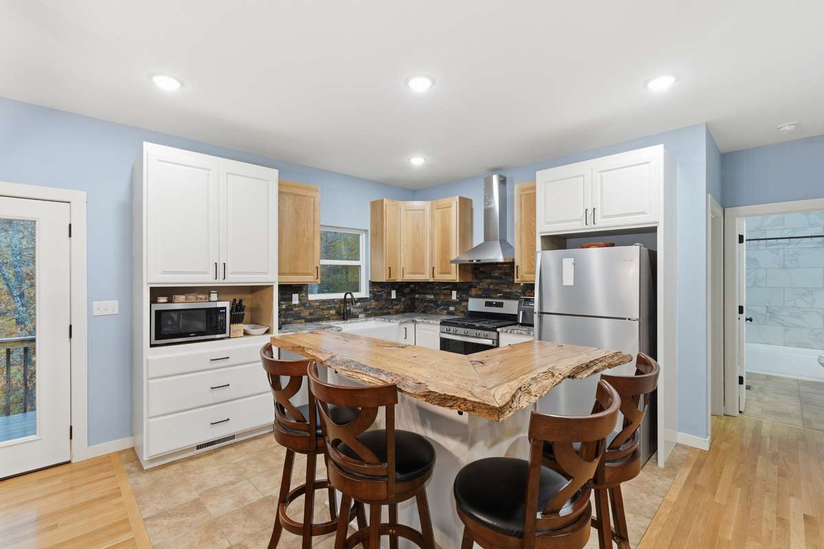 Kitchen is 12x14 with tile floor. Island top is a wide Red Oak board.