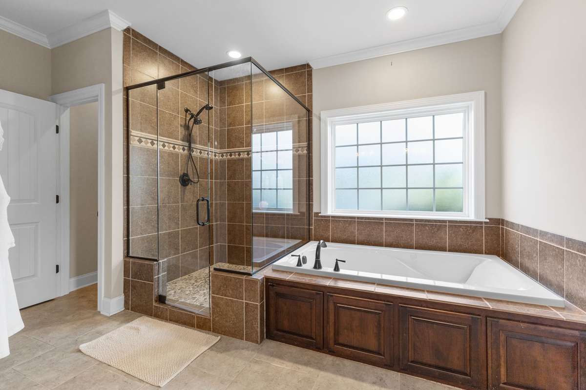 Newly retiled master shower and bath.