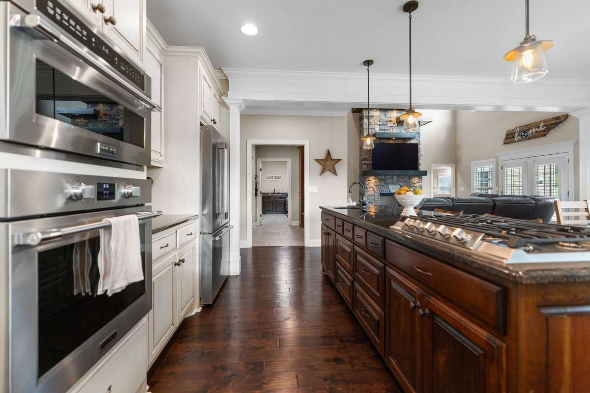Double ovens, built in gas range, and additional chef sink. An entertainer's DREAM!
