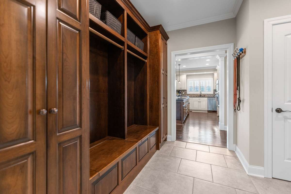Just off the garage, you have a mudroom with beautiful cabinetry and locker storage as well as a large coat closet.
