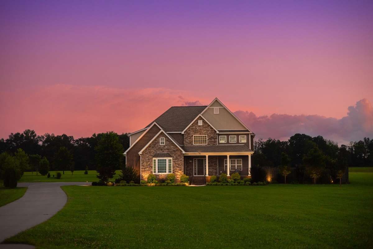 Nighttime ambiance with high-end landscape lighting.