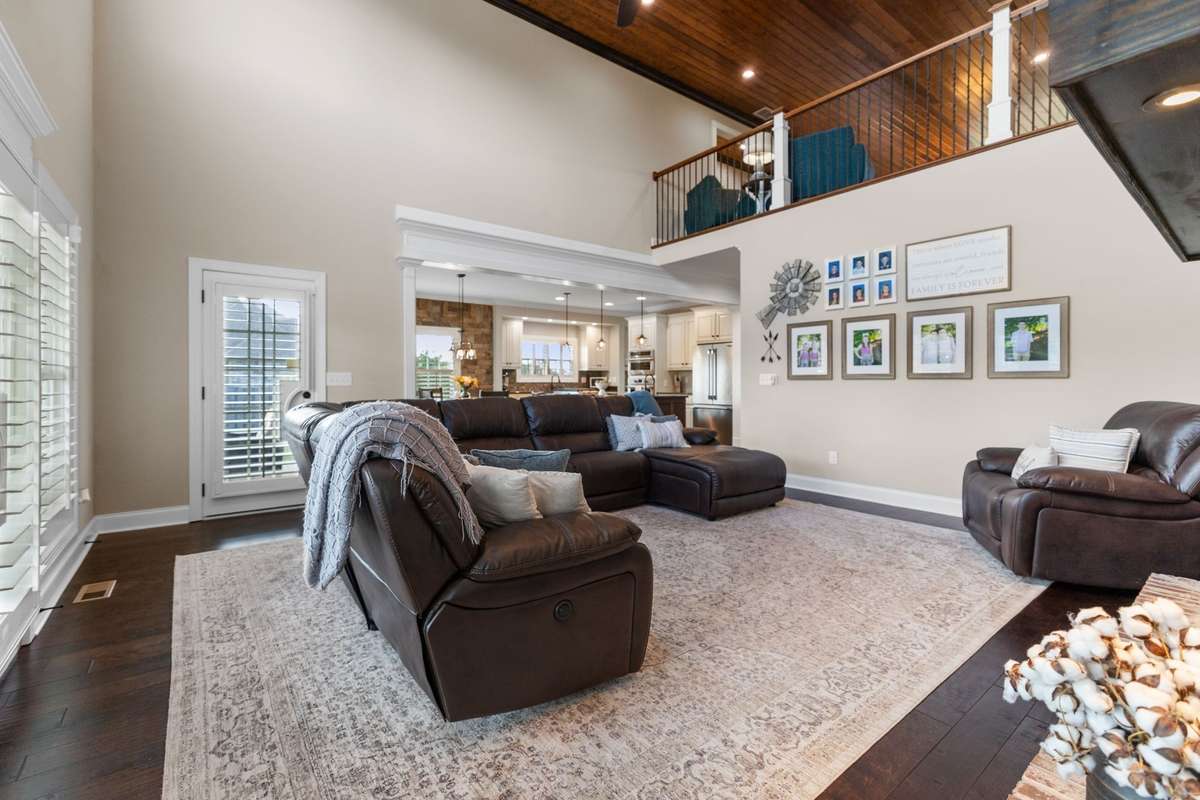 The upstairs loft area is another flex space, open to the living room. Perfect for kids or guests looking for a little retreat.