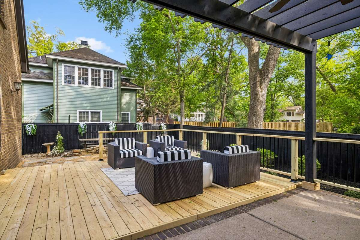 Step outside to your own private backyard sanctuary, where a newly added deck, pea gravel courtyard, and paver patio create the perfect setting for relaxing or entertaining.