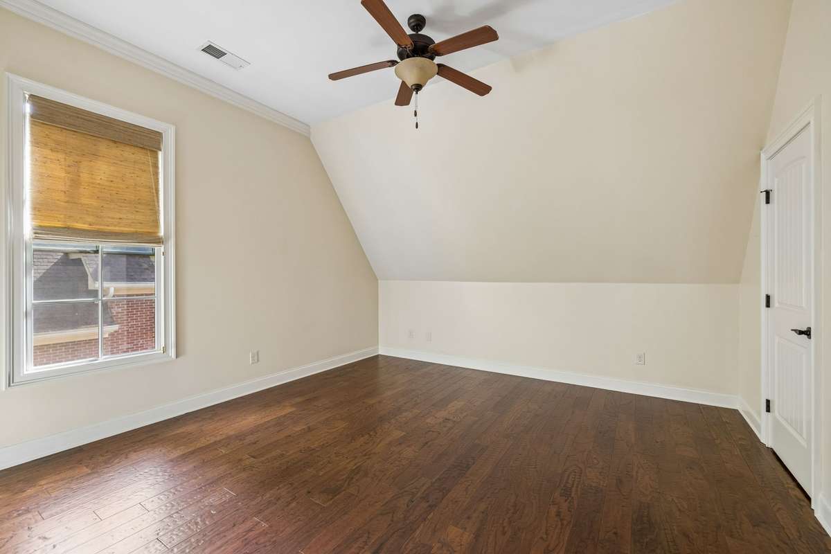 Two additional bedrooms each feature their own ensuite baths, offering comfort and privacy for each member of the household.