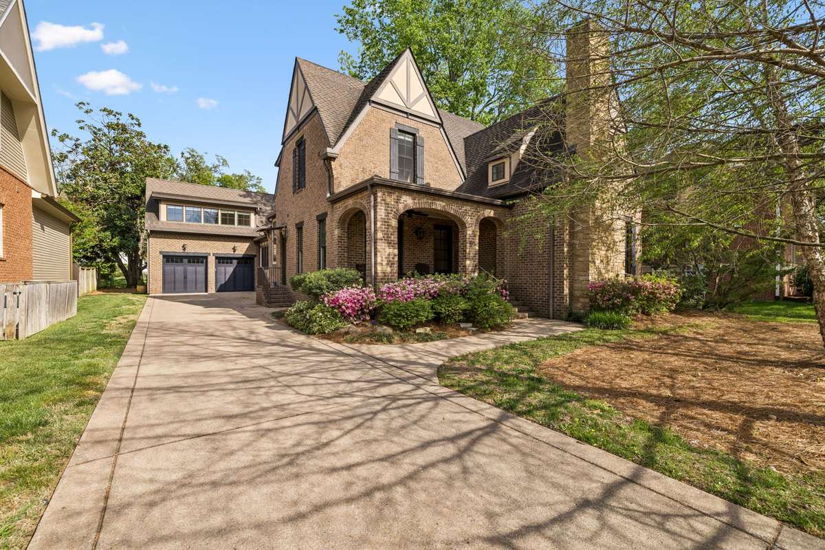 Welcome to this exquisite all-brick home, ideally located just minutes from the charm and character of historic downtown Franklin.