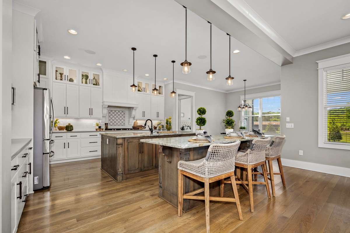 Love to cook?  This kitchen has not one, but two quartz islands, soft close cabinets and drawers and undermount lighting.