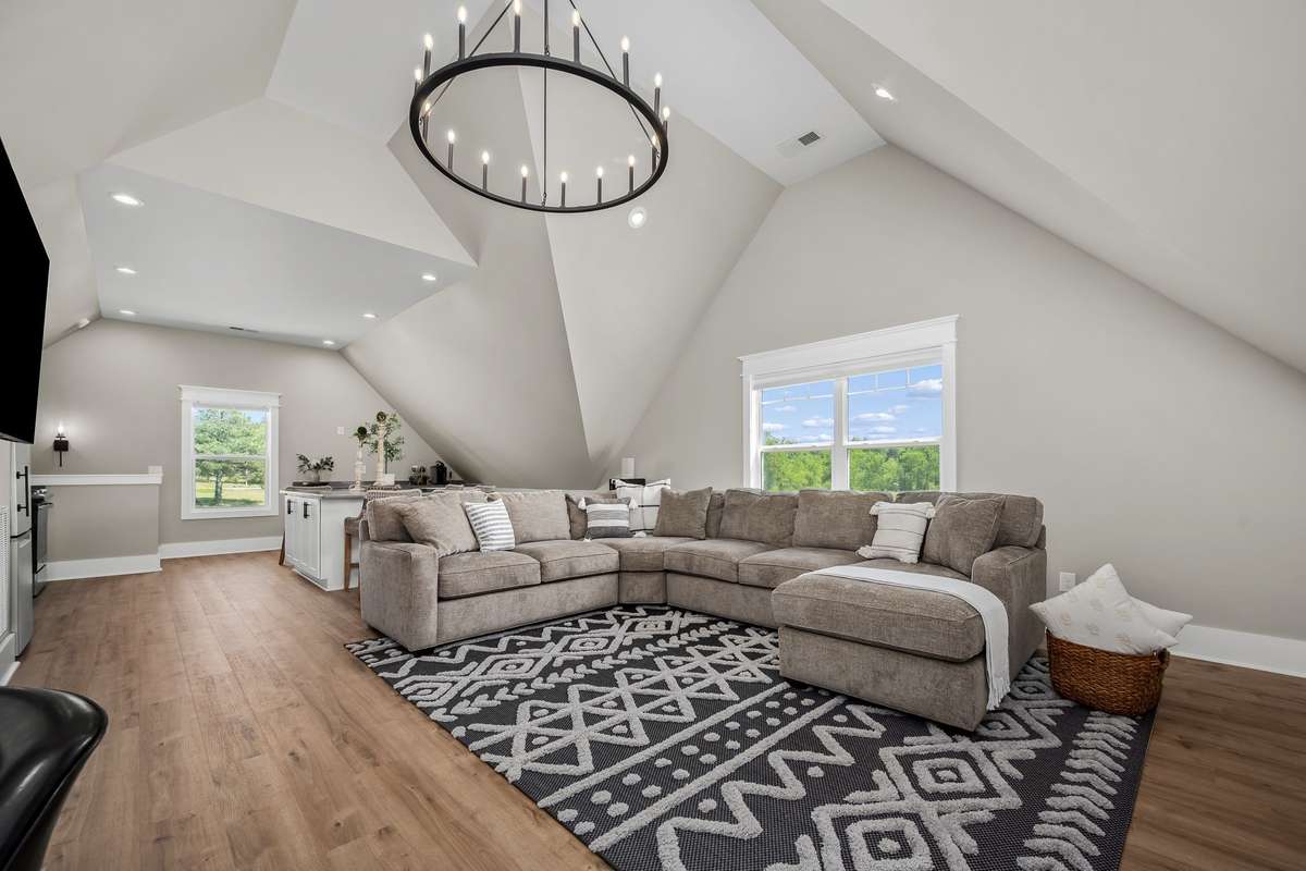 The living room is vaulted and open to the kitchen making it feel even more spacious