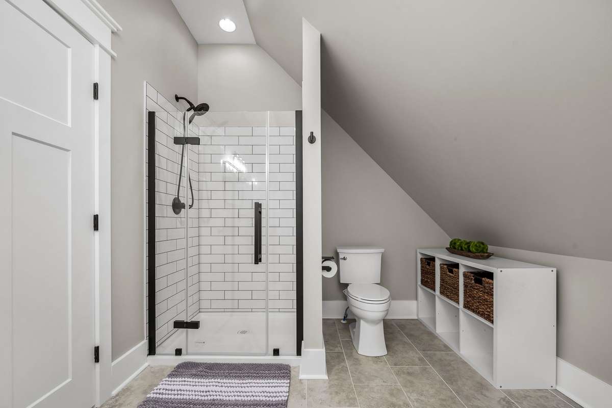 Spacious apartment bath with tile shower