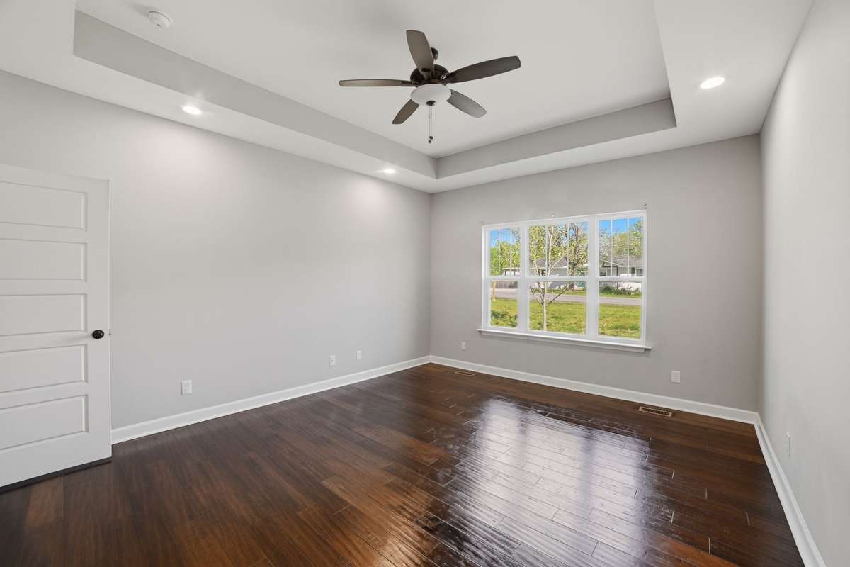 Primary Bedroom with Natural Light and Vaulted Ceilings
