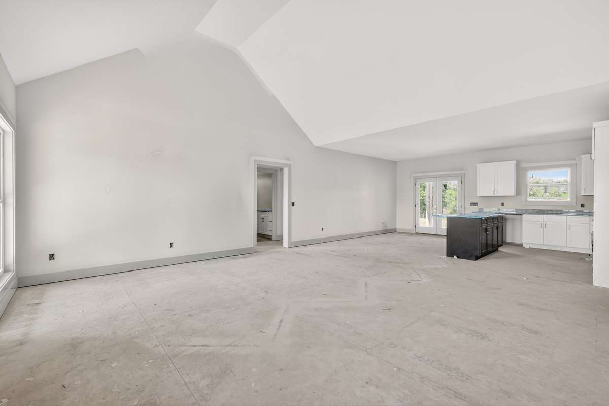 Open floor plan with living, dining, and kitchen space all centrally located