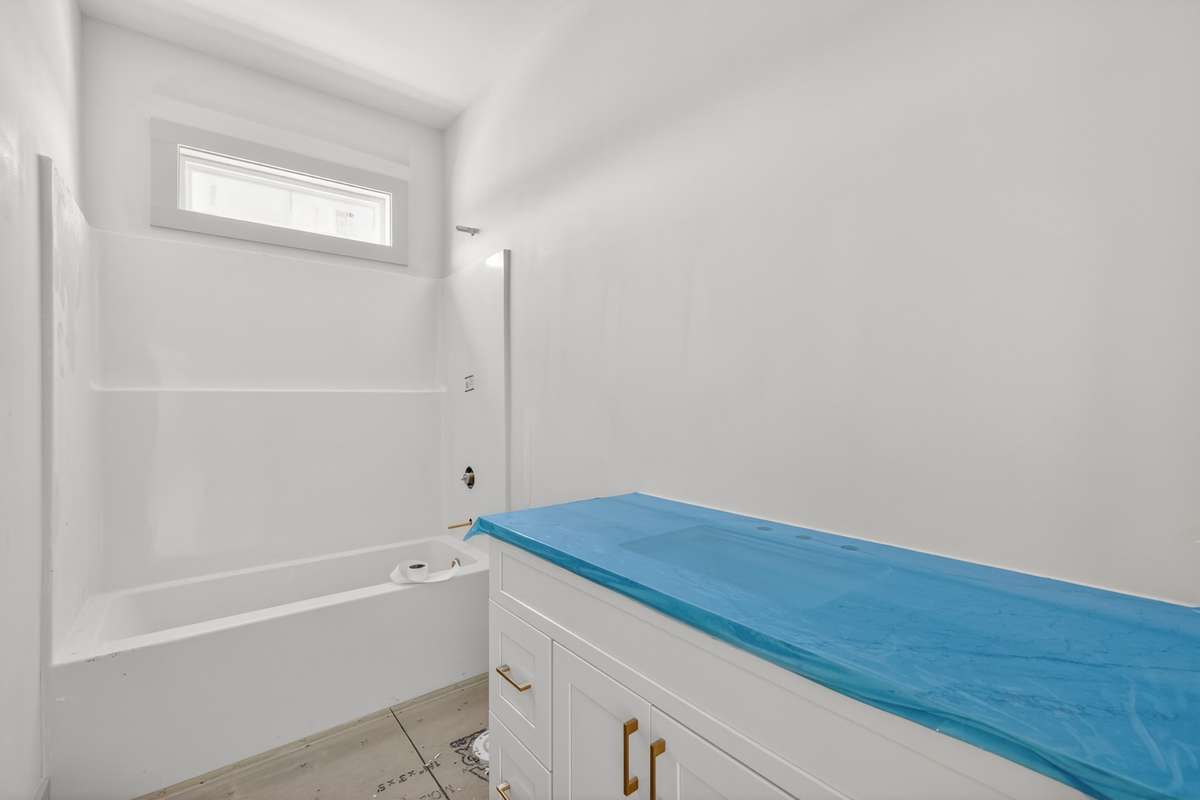 Guest bathroom with granite countertops and tile flooring to be installed