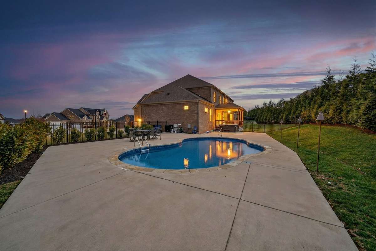 The owners added this gorgeous pool, expert landscapers added trees and shrubs, and the view from the back yard is incredible especially at night watching the sunset. .