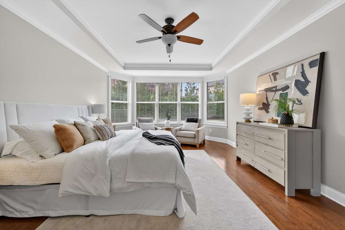 Private primary retreat featuring beautiful bay windows and abundant natural light.