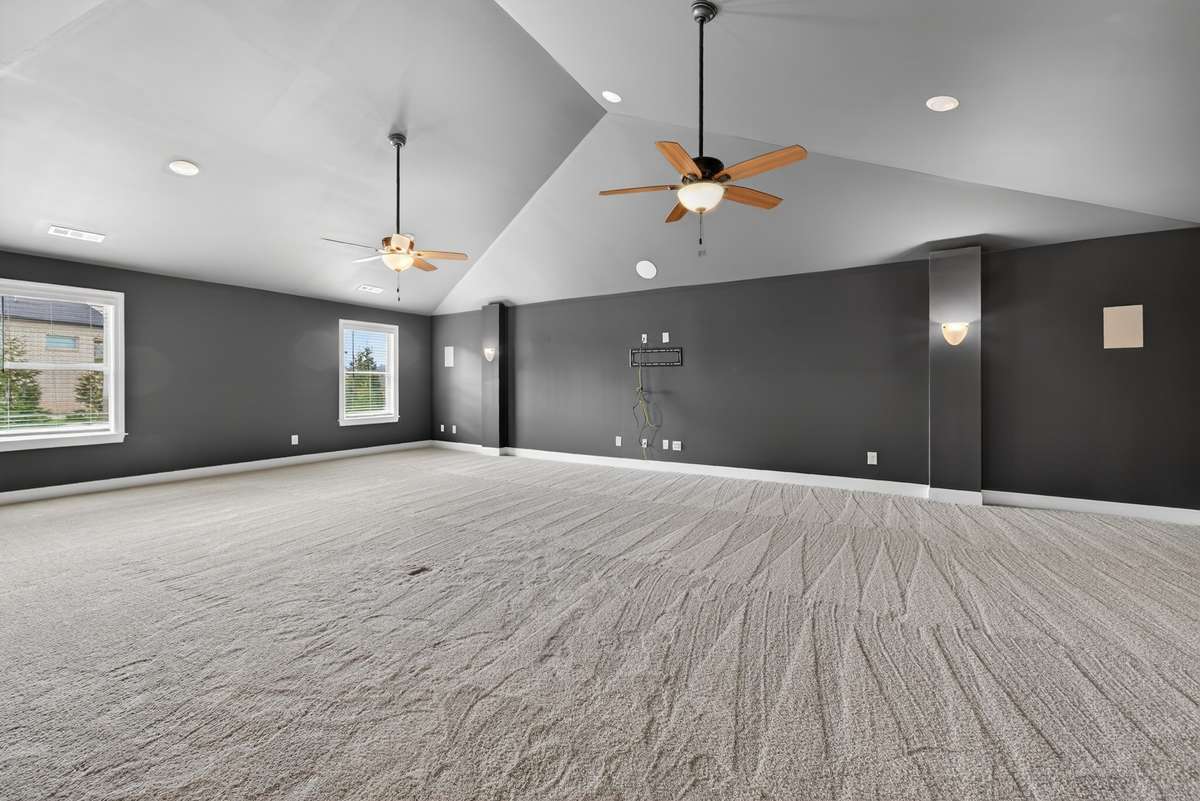 The extra large bonus room is one of the largest we'e ever seen! The owners have enjoyed this room for sports and move watching. It has walkout attic storage off this room.