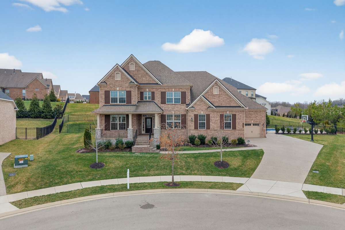 Commanding curb appeal on a premium cul-de-sac lot—where scale, setting, and location come together.