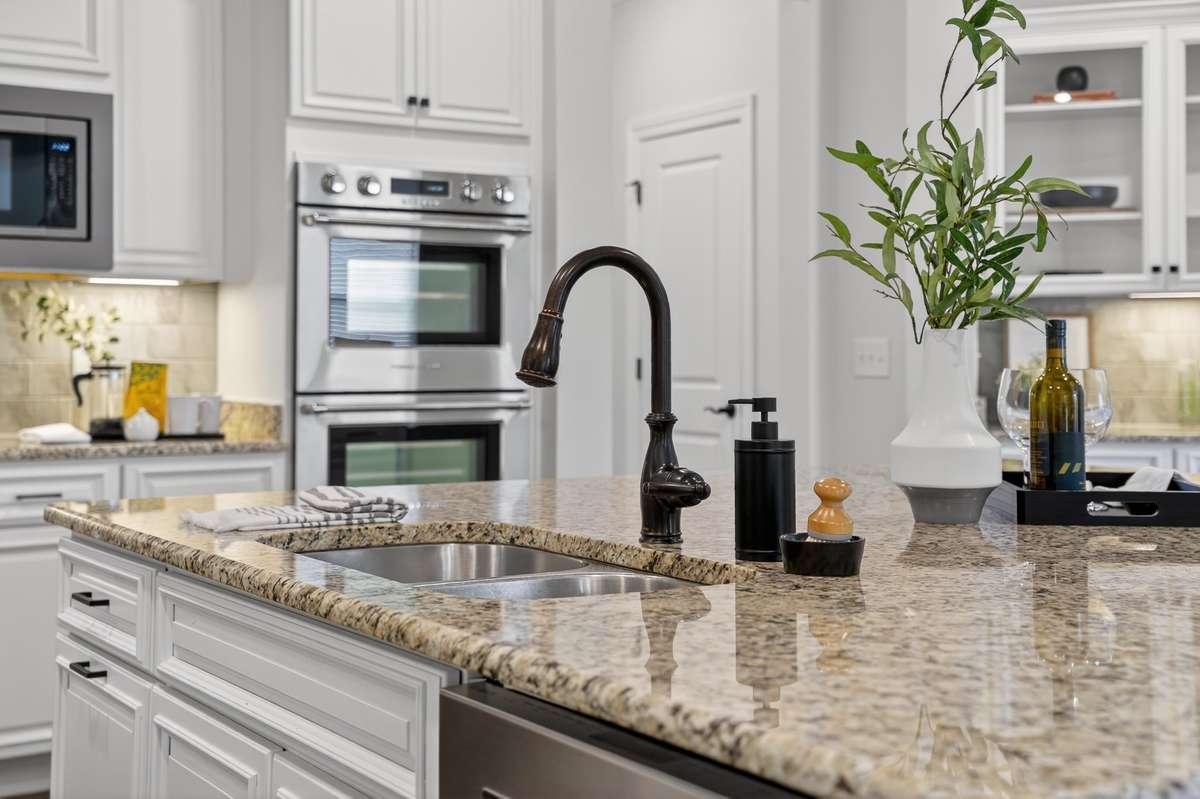 Thoughtfully designed kitchen with ample workspace and effortless flow into the main living areas.