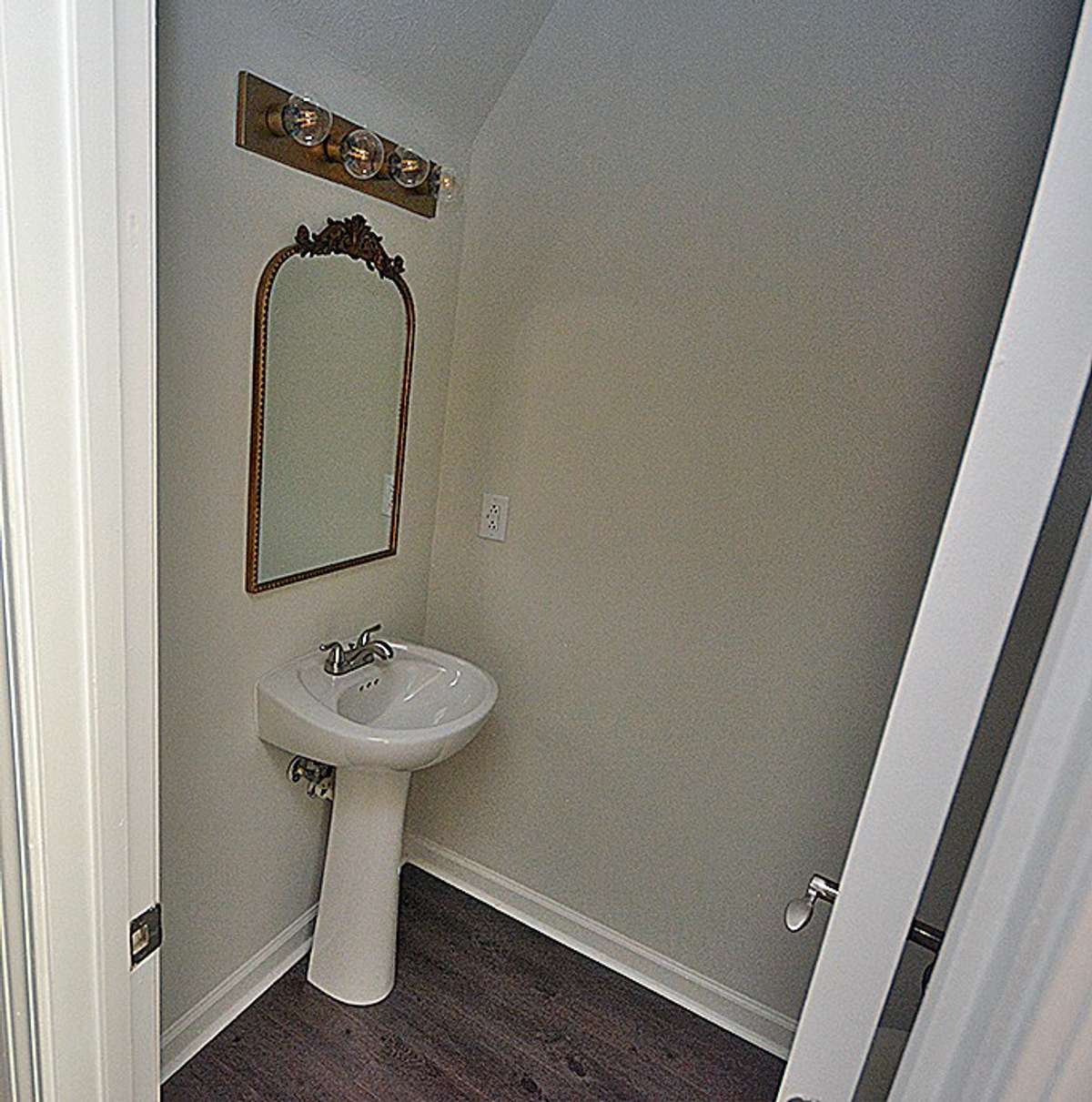 this is a view of the half bath located downstairs.