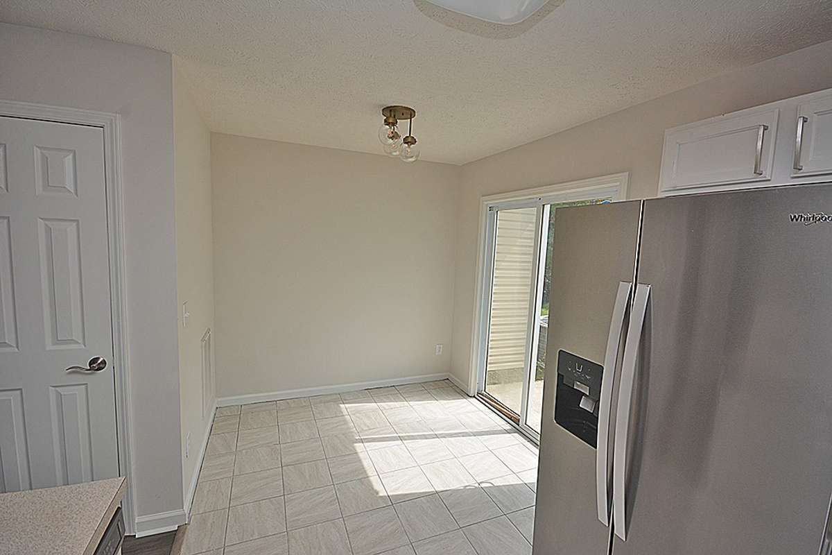 This breakfast area is right off of the kitchen with a nice view of the back patio.