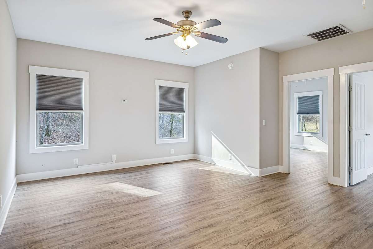 A separate sitting area offers flexible space for entertaining, relaxing, or creating a cozy retreat, giving everyone room to spread out.