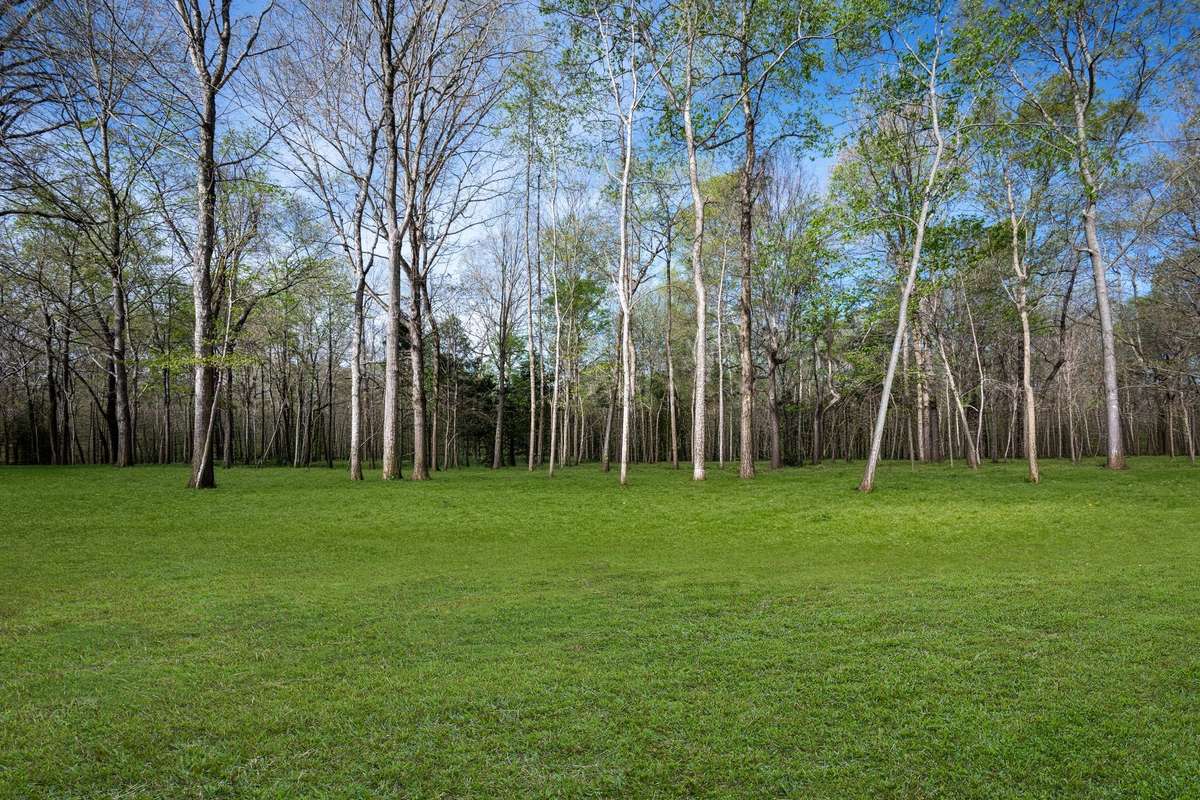 PARK-LIKE + Level 1.52 Acres+/- that is GORGEOUS!!! 
 NOTE: Green Grass Edits on Exterior Photos