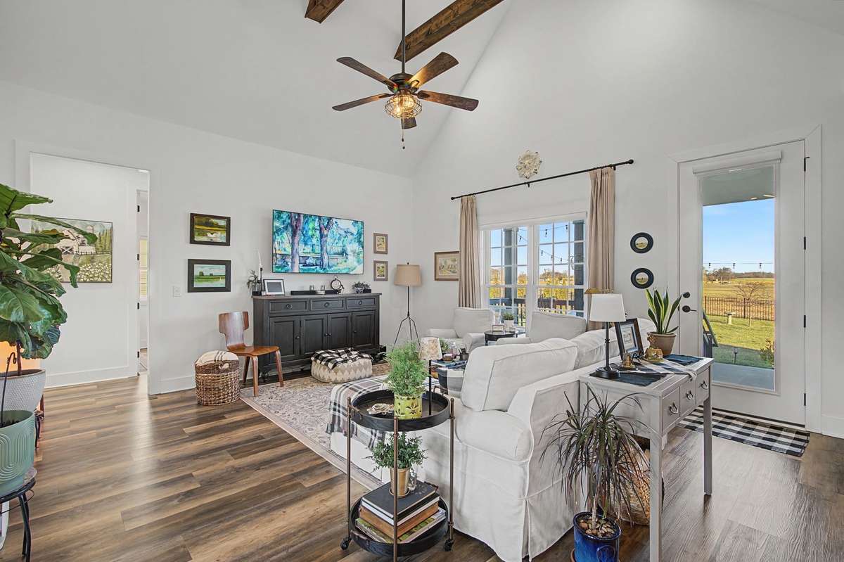 Soaring ceilings with wooden beams in the great room. Eight foot doors throughout.