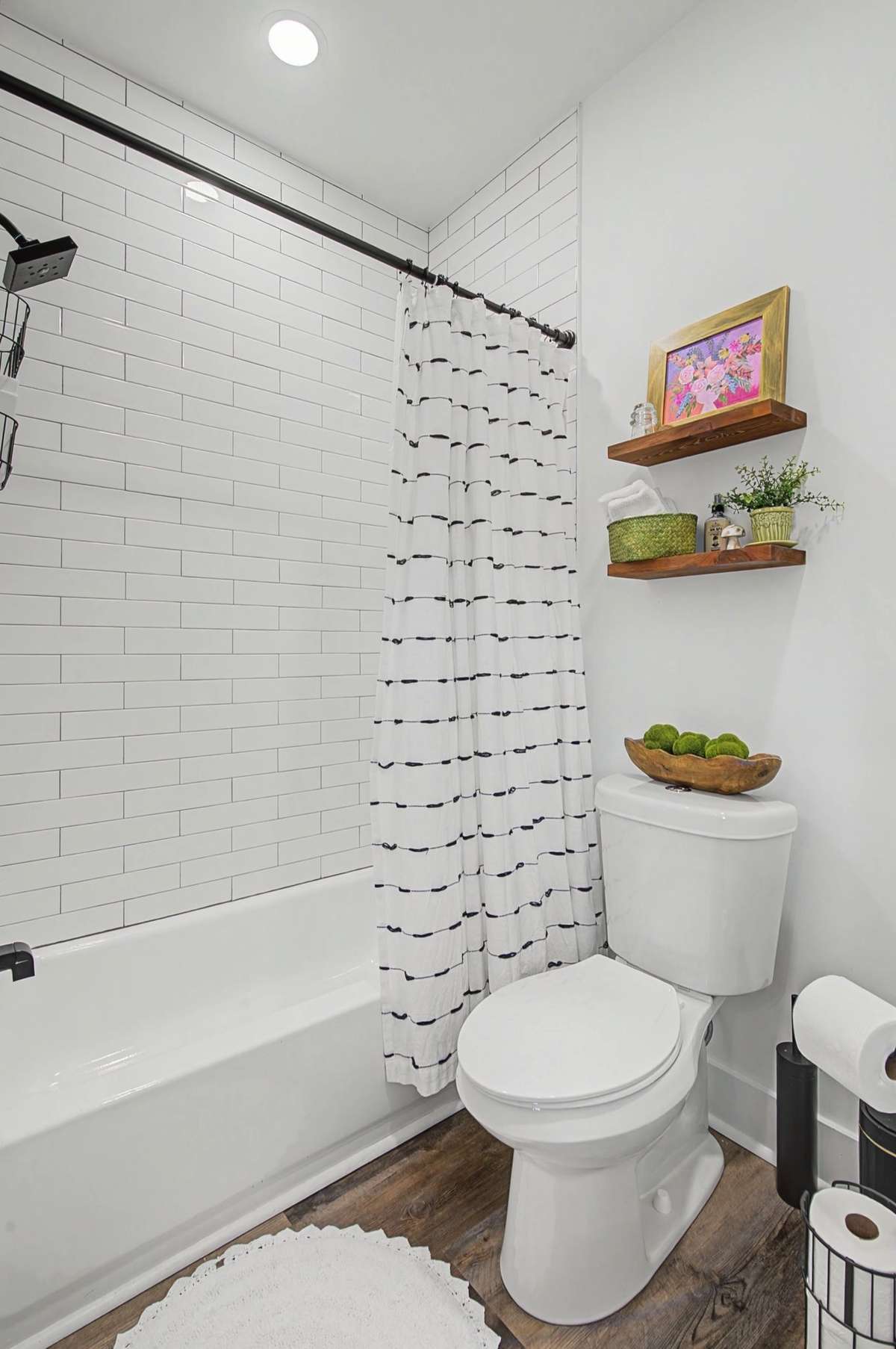 Oversized cast iron tub with tile in the secondary bath.