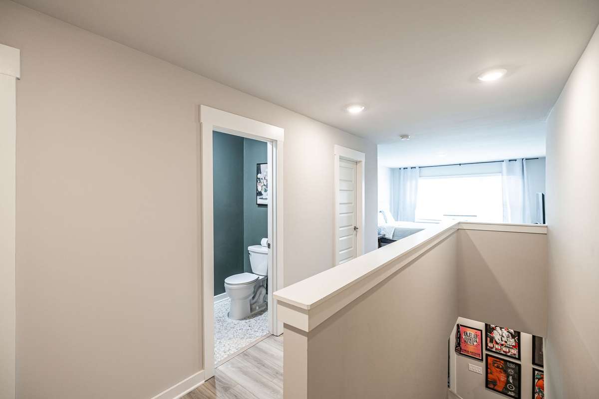 Upstairs loft with half bath can be used as a guest room, hobby or excercise room