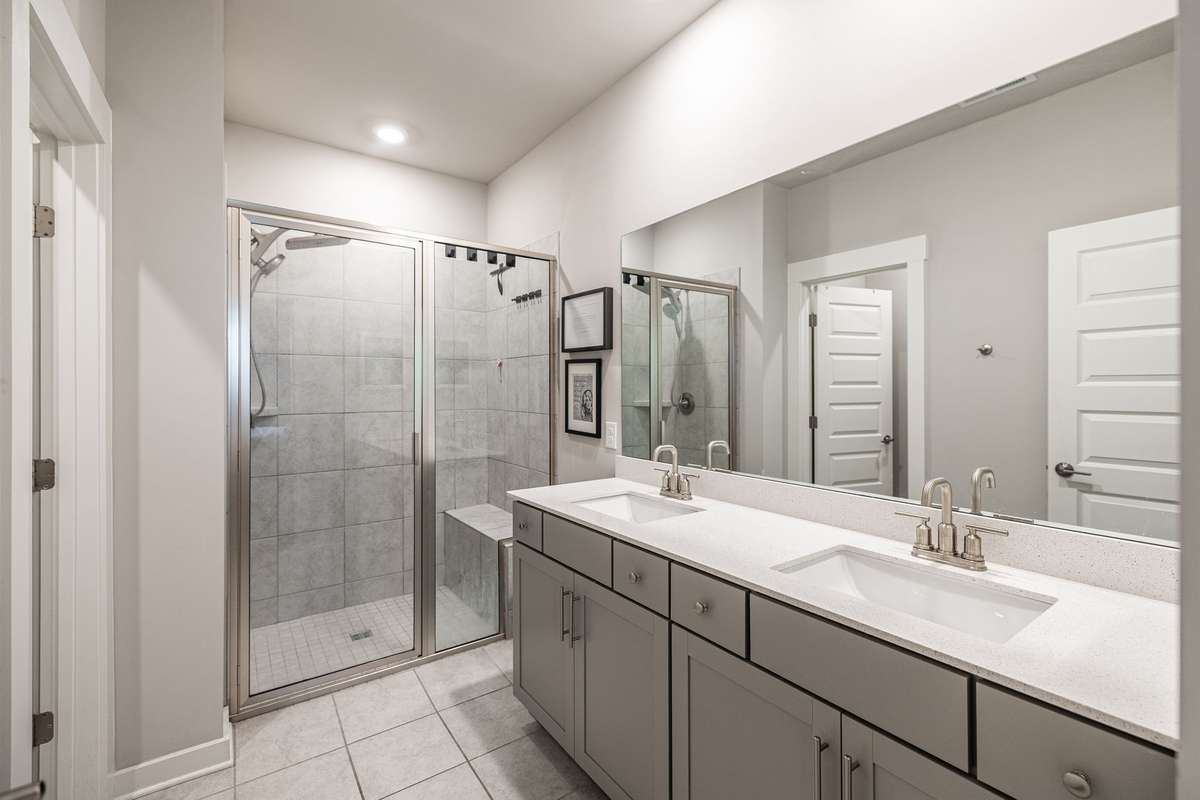 Primary Bathroom with double vanities and oversized shower