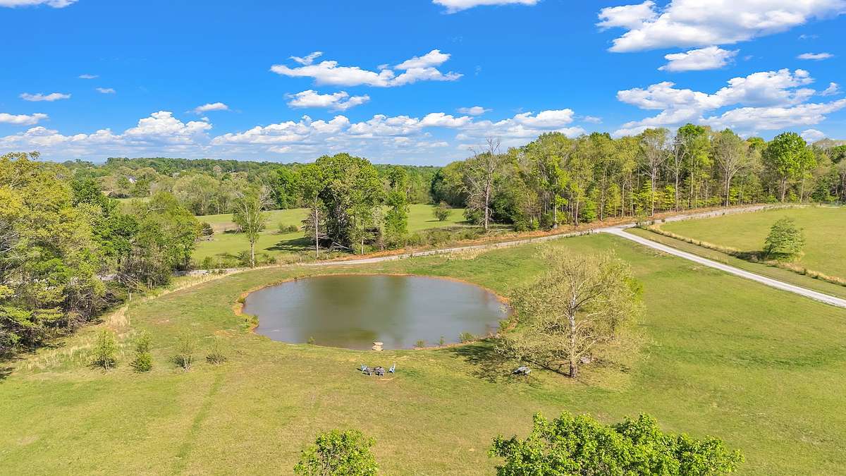 3/4 acre pond with stone dock and firepit.  There is water down at the pond for easy fish cleaning and preparation