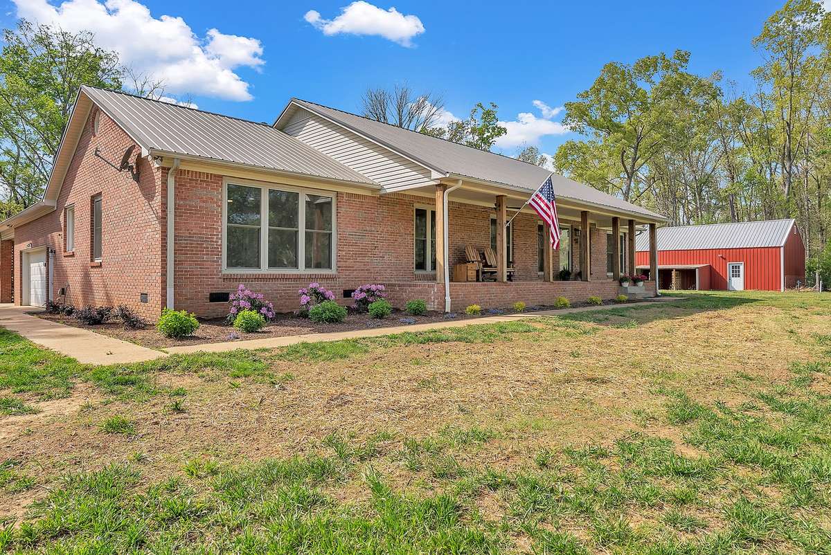 The primary home is a single-level ranch featuring a spacious 1260 sq ft three-
car garage with generous storage in both the garage and the attic. 6’ tall
windows throughout, allowing you to enjoy the country view around you.
