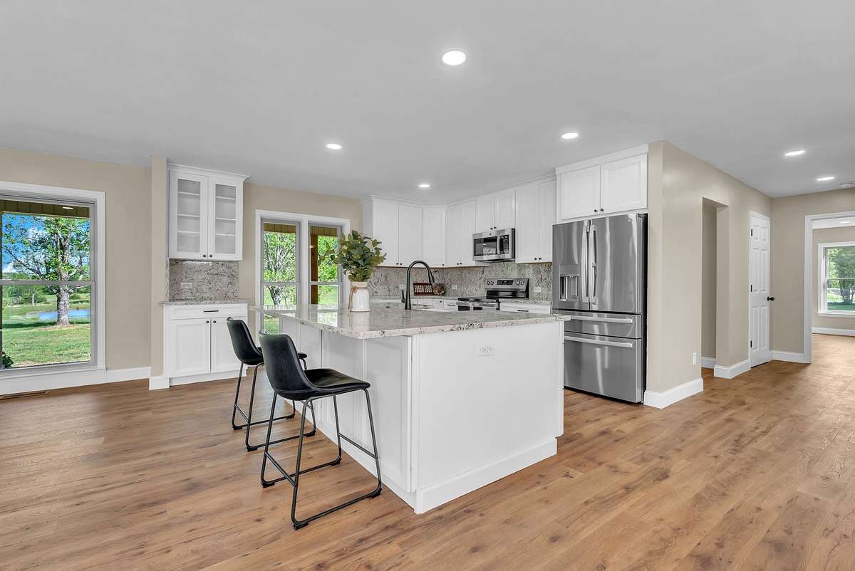 The Island has enough room to seat 4 full-size counter stools comfortably. Includes additional
cabinets below island seating area. Touch on and off faucet and a perfect view of the pond and beautiful front yard.